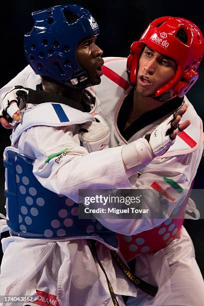 Anthony Obame of Gabon competes with Sajjad Mardani of Iran during the men's +87 kg final combat of WTF World Taekwondo Championships 2013 at the...