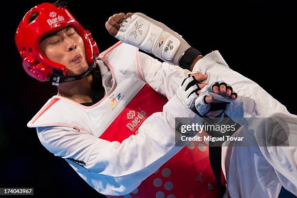 Rafael Castillo of Cuba competes with Mao Zhao Yong of China during the men's -87 kg final combat of WTF World Taekwondo Championships 2013 at the...