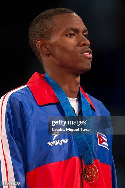 Rafael Castillo of Cuba receives the gold medal during the men's -87 kg final combat of WTF World Taekwondo Championships 2013 at the exhibitions...