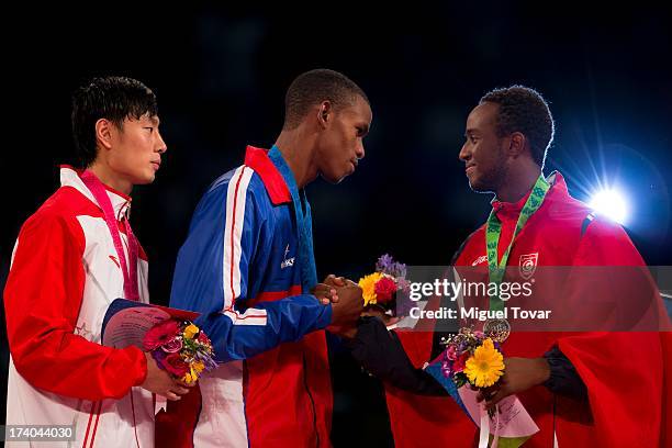Rafael Castillo of Cuba receives the gold medal during the men's -87 kg final combat of WTF World Taekwondo Championships 2013 at the exhibitions...