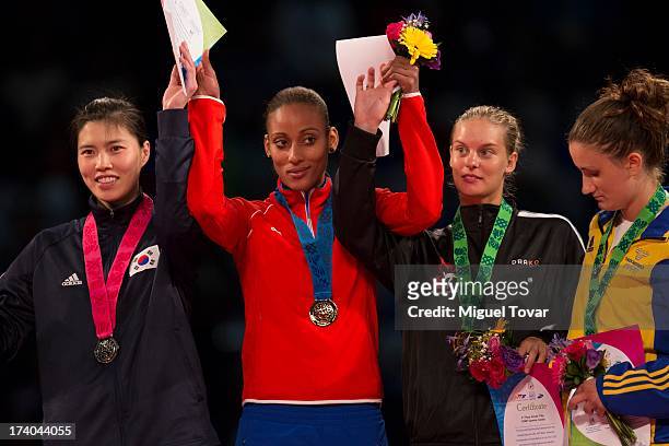 Glenhis Hernandez of Cuba receives the gold medal during the women's -73 kg final combat of WTF World Taekwondo Championships 2013 at the exhibitions...