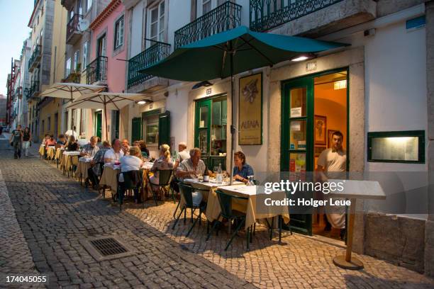 people at alfaia restaurant in bairro alto - mid distance stockfoto's en -beelden