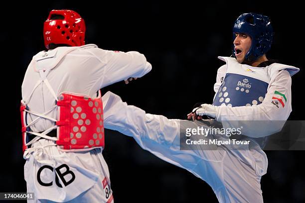Robelis Despaigner of Cuba competes with Sajjad Mardani of Iran during the +87 kg semifinal combat of WTF World Taekwondo Championships 2013 at the...
