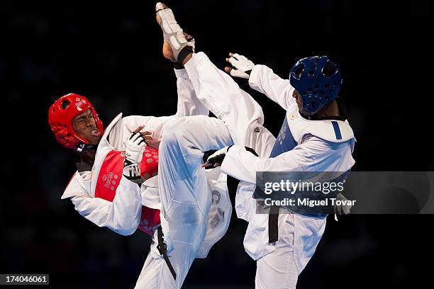 Rafael Castillo of Cuba competes with Yassine Trabelsi of Tunisia during the -87 kg semifinal combat of WTF World Taekwondo Championships 2013 at the...