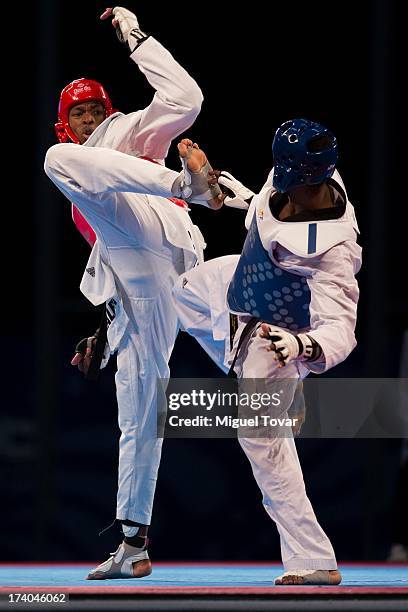 Rafael Castillo of Cuba competes with Yassine Trabelsi of Tunisia during the -87 kg semifinal combat of WTF World Taekwondo Championships 2013 at the...