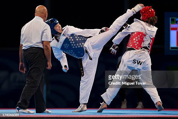 In-Jong Lee of Korea competes with Casandra Ikonen of Sweden during the -87 kg semifinal combat of WTF World Taekwondo Championships 2013 at the...
