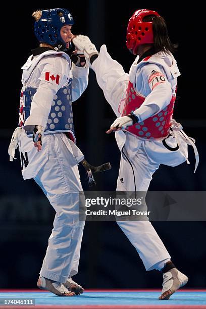 Glenhis Hernandez of Cuba competes with Jasmine Vokey of Canada during the women«s-73 kg semifinal combat of WTF World Taekwondo Championships 2013...