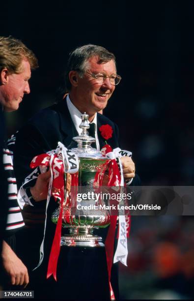 May 1999 FA Cup Final Manchester United v Newcastle United - Manchester manager Alex Ferguson holds the cup, flanked by Steve McClaren.