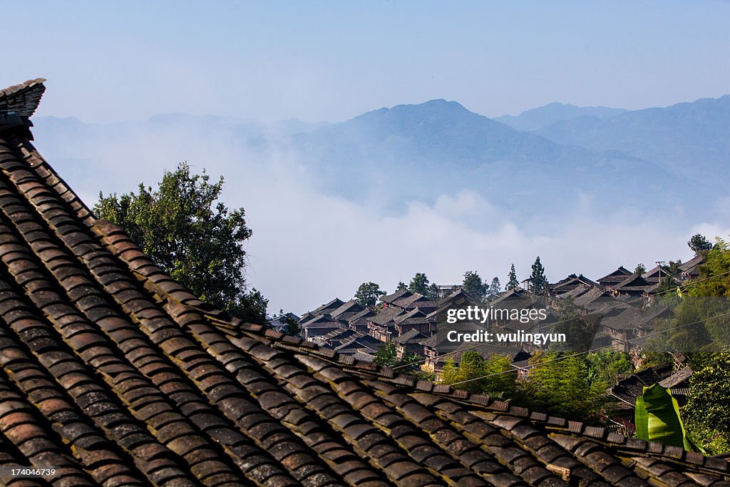 Chinese Miao village in morning fog