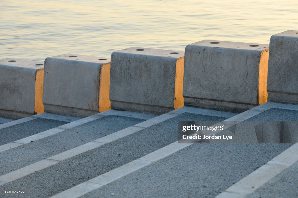 Concrete footpath and low stone wall on the esplanade