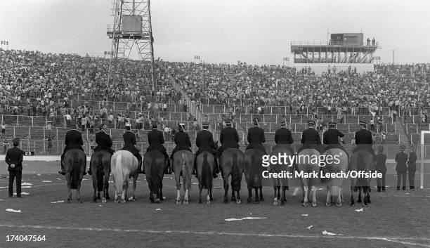 10th May 1980 Scottish FA Cup Final - Celtic v Rangers, Hampden Park is cleared bt police horses after the pitch invasion by Celtic fans celebrating...
