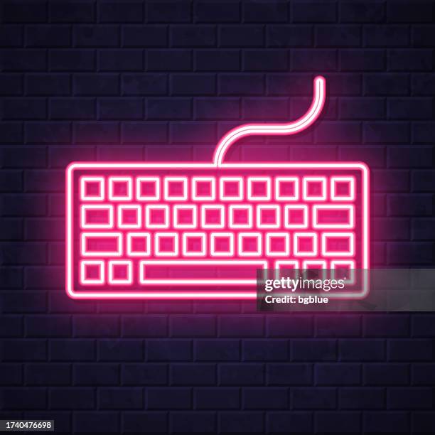 keyboard. glowing neon icon on brick wall background - typing on computer night stock illustrations