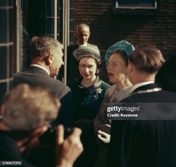 Queen Elizabeth II is accompanied by Queen Juliana of the Netherlands during a state visit to the Netherlands, March 25th - 27th 1958.