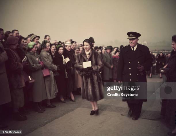 Queen Elizabeth II arriving at Cheltenham Racecourse for the Gold Cup race meeting, Gloucestershire, March 5th 1953.
