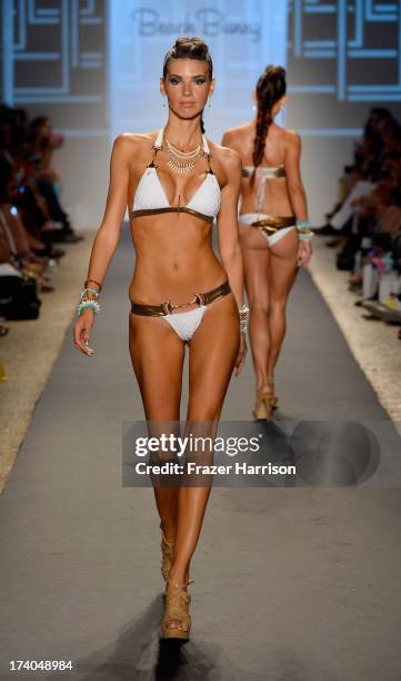 Model walks the runway at the Beach Bunny show with TRESemme during Mercedes-Benz Fashion Week at Cabana Grande at the Raleigh on July 19, 2013 in...