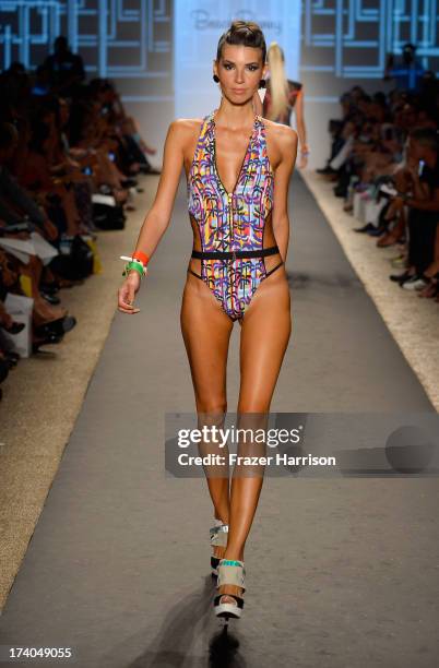 Model walks the runway at the Beach Bunny show with TRESemme during Mercedes-Benz Fashion Week at Cabana Grande at the Raleigh on July 19, 2013 in...