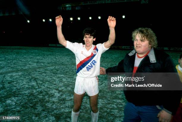 May 1987 FA Cup 3rd round - Crystal Palace v Nottingham Forest - Palace hero Alan Irvine celebrates on the frozen pitch after the match with a...