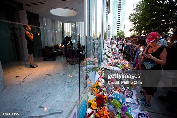 Fans pay Tribute at the Candle Light Vigil for Cory Monteith at the Fairmont Pacific Rim on July 19, 2013 in Vancouver, Canada.