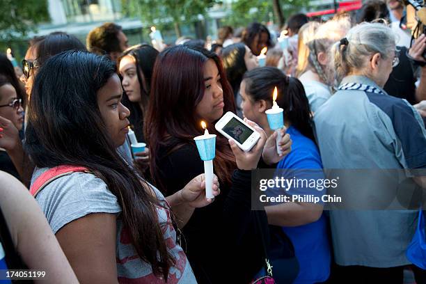 Fans pay Tribute at the Candle Light Vigil for Cory Monteith at the Fairmont Pacific Rim on July 19, 2013 in Vancouver, Canada.