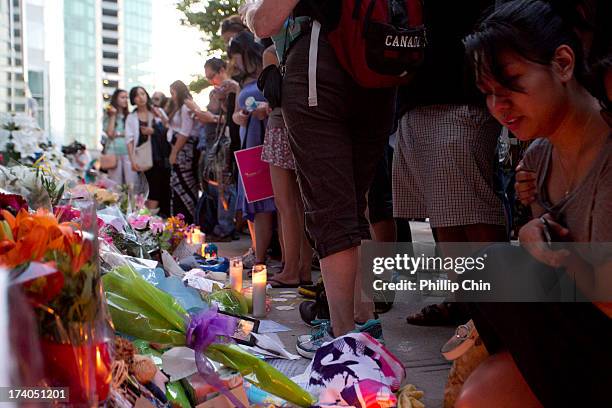 Fans pay Tribute at the Candle Light Vigil for Cory Monteith at the Fairmont Pacific Rim on July 19, 2013 in Vancouver, Canada.