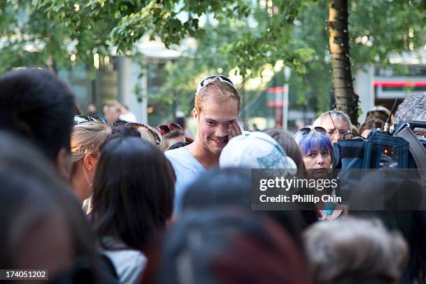 Fans pay Tribute at the Candle Light Vigil for Cory Monteith at the Fairmont Pacific Rim on July 19, 2013 in Vancouver, Canada.