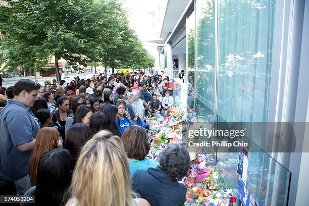 Fans pay Tribute at the Candle Light Vigil for Cory Monteith at the Fairmont Pacific Rim on July 19, 2013 in Vancouver, Canada.