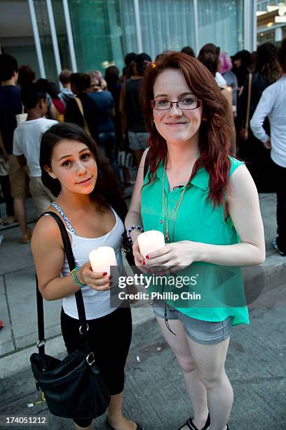 Fans pay Tribute at the Candle Light Vigil for Cory Monteith at the Fairmont Pacific Rim on July 19, 2013 in Vancouver, Canada.