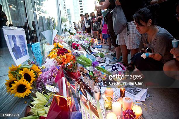 Fans pay Tribute at the Candle Light Vigil for Cory Monteith at the Fairmont Pacific Rim on July 19, 2013 in Vancouver, Canada.