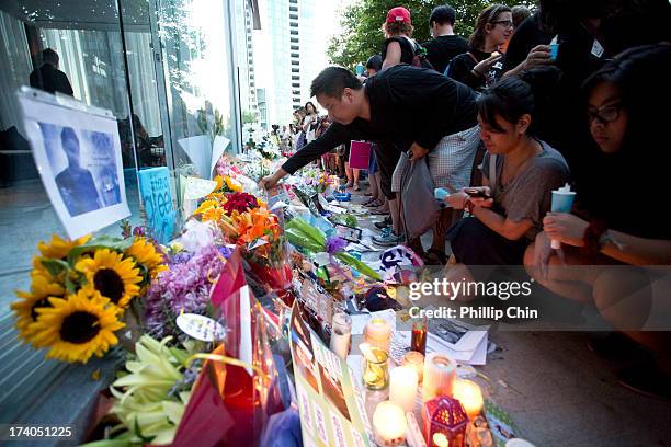 Fans pay Tribute at the Candle Light Vigil for Cory Monteith at the Fairmont Pacific Rim on July 19, 2013 in Vancouver, Canada.