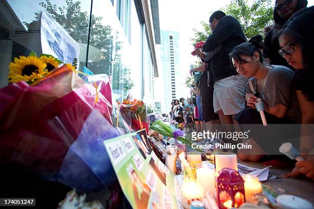 Fans pay Tribute at the Candle Light Vigil for Cory Monteith at the Fairmont Pacific Rim on July 19, 2013 in Vancouver, Canada.