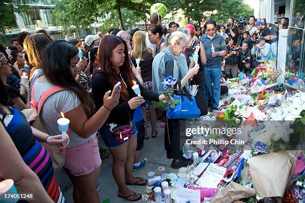 Fans pay Tribute at the Candle Light Vigil for Cory Monteith at the Fairmont Pacific Rim on July 19, 2013 in Vancouver, Canada.