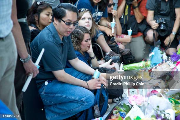 Fans pay Tribute at the Candle Light Vigil for Cory Monteith at the Fairmont Pacific Rim on July 19, 2013 in Vancouver, Canada.