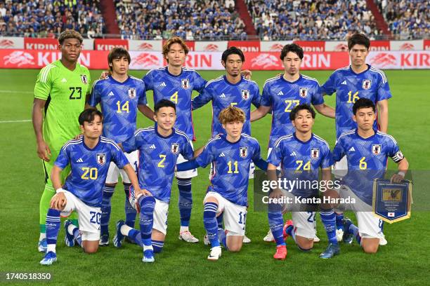 Japan players line up for the team photos prior to the international friendly match between Japan and Tunisia at Noevir Stadium Kobe on October 17,...