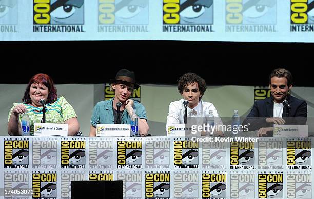 Writer Cassandra Clare, actors Jamie Campbell Bower, Robert Sheehan, and Kevin Zegers speak onstage at the Sony and Screen Gems panel for "The Mortal...