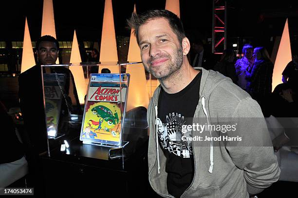 Director Zack Snyder poses in front of Action Comics issue at DC Entertainment and Warner Bros. Host Superman 75 party at San Diego Comic-Con at Hard...