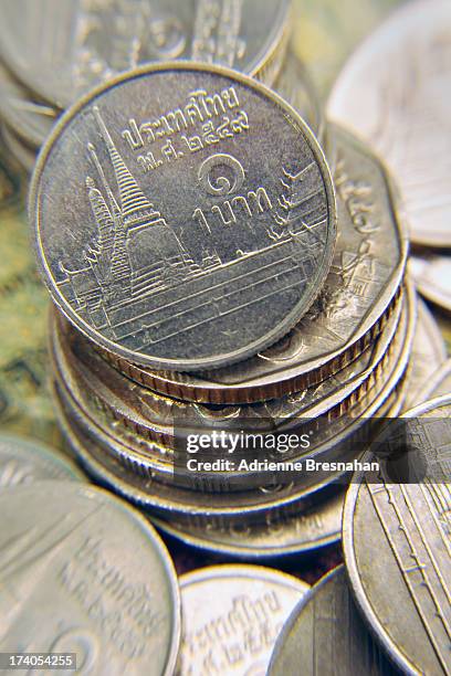 tower of baht - thai coin stock pictures, royalty-free photos & images