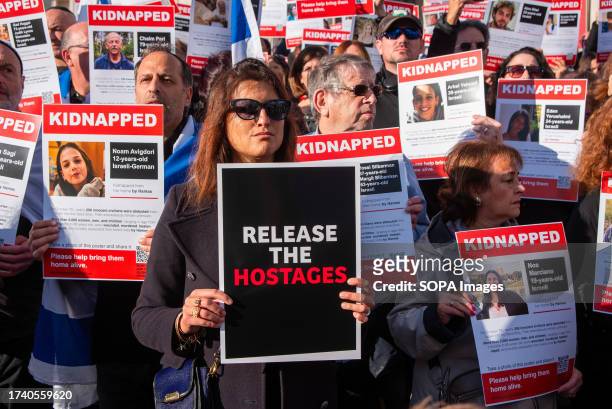 Protesters hold placards with the names of the hostages on them during the demonstration on the Trafalgar Square in London. In London's Trafalgar...