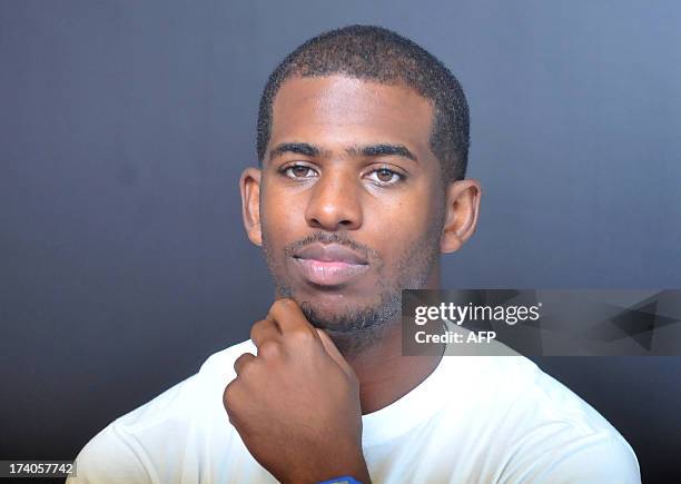 Basketball player Chris Paul of Los Angeles Clippers listens during a Take Flight press conference in Taipei on July 20, 2013. AFP PHOTO / Mandy CHENG