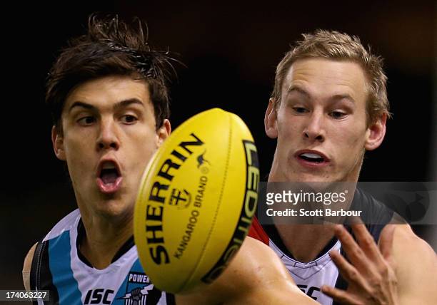 Angus Monfries of the Power and Jimmy Webster of the Saints compete for the ball during the round 17 AFL match between the St Kilda Saints and Port...