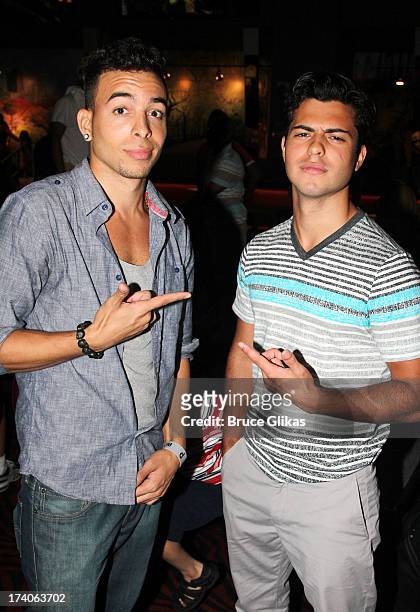 Pop/ R&B Singer/Rapper Dash and David Castro pose at the "Tio Papi" Photo Call at Planet Hollywood Times Square on July 19, 2013 in New York City.