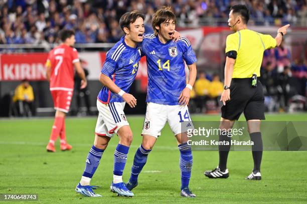 Junya Ito of Japan celebrates with teammate Takefusa Kubo after scoring his team's second goal during the international friendly match between Japan...