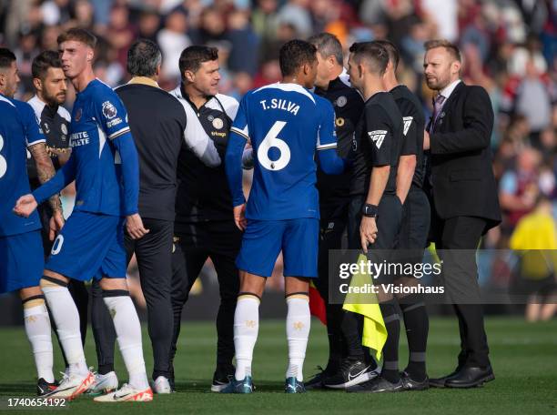 Chelsea manager Mauricio Pochettino confronts referee Stuart Attwell at half time during the Premier League match between Burnley FC and Chelsea FC...