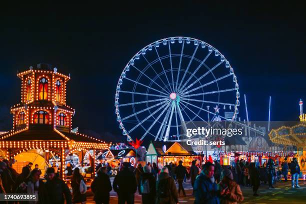 winter wonderland - christmas themed amusement park in hyde park, london, uk - winter wonderland london stock pictures, royalty-free photos & images