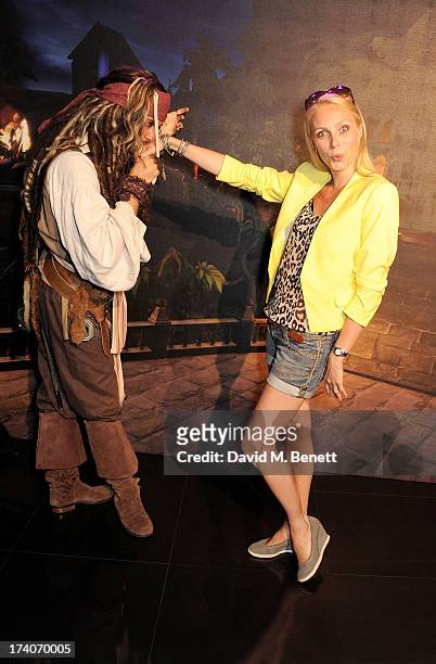 Camilla Dallerup and Captain Jack Sparrow attend an exclusive launch event for upcoming videogame 'Disney Infinity', released nationwide on August...