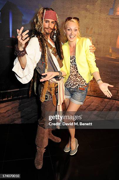 Camilla Dallerup and Captain Jack Sparrow attend an exclusive launch event for upcoming videogame 'Disney Infinity', released nationwide on August...