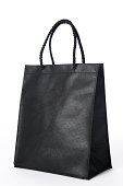 Isolated shot of blank black shopping bag on white background