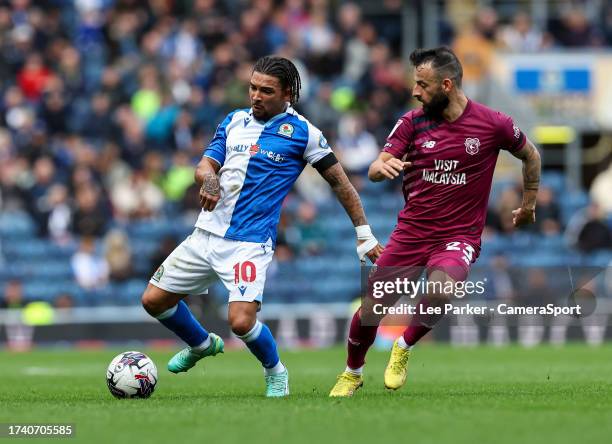 Blackburn Rovers' Tyrhys Dolan passes the ball under pressure from Cardiff City's Manolis Siopis during the Sky Bet Championship match between...