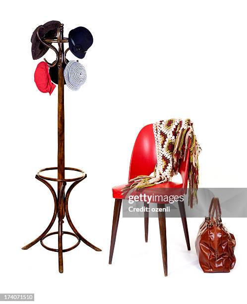 knit shawl on red chair with luggage and coat rack - coat stand stock pictures, royalty-free photos & images