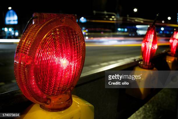 street barricades light at night - traffic in the background - road closed stock pictures, royalty-free photos & images