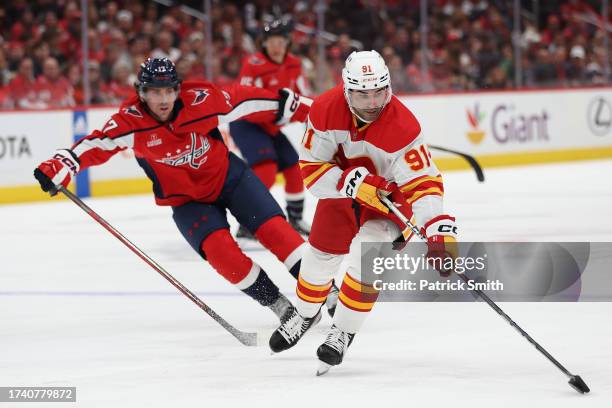 Nazem Kadri of the Calgary Flames skates against the Washington Capitals during the third period at Capital One Arena on October 16, 2023 in...